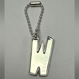 Gucci Silver tag/charm "W"